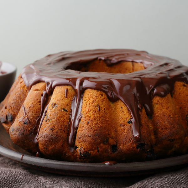 Doces Gourmet lucrativos. Imagem de um bolo com cobertura de Chocolate.